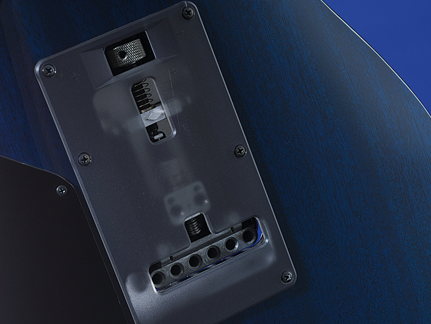 The SV5470 has a thumb screw to facilitate string tension adjustment without having to take the cover off the tremolo cavity